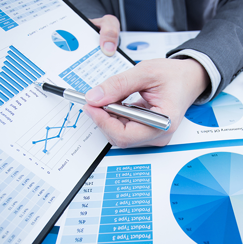 Image of graphs being read and marked up